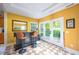 Entertain in this bar area featuring tile floors, a dark bar, and outdoor access at 121 Walter Hagen Dr, Mebane, NC 27302