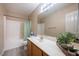 Bathroom offers a wood vanity with plants, a toilet, and a shower with green curtain at 121 Walter Hagen Dr, Mebane, NC 27302