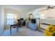 Spacious bedroom features a work space, bed, sitting area, and large bright windows at 121 Walter Hagen Dr, Mebane, NC 27302