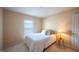 Inviting bedroom with a plush bed, bedside lamp, and lots of light from the window at 121 Walter Hagen Dr, Mebane, NC 27302