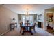 Elegant dining room with chandelier and french doors, perfect for entertaining guests or Gathering dinners at 121 Walter Hagen Dr, Mebane, NC 27302