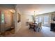 Dining room with chandelier and french doors, showcasing ample natural light and neutral color palette at 121 Walter Hagen Dr, Mebane, NC 27302