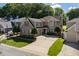 Charming two-story home with manicured front lawn and mature landscaping at 121 Walter Hagen Dr, Mebane, NC 27302