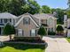 Two-story home with a well-manicured lawn and mature trees at 121 Walter Hagen Dr, Mebane, NC 27302