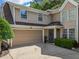 Charming home with a two-car garage, tan siding, a well-manicured lawn, and a welcoming front door at 121 Walter Hagen Dr, Mebane, NC 27302