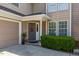 Close up view of a home's front entrance and garage, featuring manicured bushes at 121 Walter Hagen Dr, Mebane, NC 27302