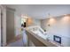 Bright hallway with white railings, a ceiling fan, and views to rooms below at 121 Walter Hagen Dr, Mebane, NC 27302