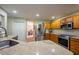 Bright kitchen with stainless steel appliances, light wood cabinets and granite countertops at 121 Walter Hagen Dr, Mebane, NC 27302