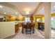 Spacious eat-in kitchen with wood cabinets, barstool seating, and open access to the main living spaces at 121 Walter Hagen Dr, Mebane, NC 27302
