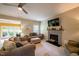 Inviting living room with fireplace, TV, and view to a bar area with outdoor access at 121 Walter Hagen Dr, Mebane, NC 27302