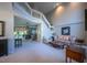 Spacious living room featuring high ceilings and a staircase, with neutral tones and comfortable seating at 121 Walter Hagen Dr, Mebane, NC 27302
