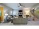 Spacious living room with a cozy fireplace, comfortable sofas, and staircase at 121 Walter Hagen Dr, Mebane, NC 27302