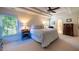 Main bedroom featuring a tray ceiling, ceiling fan, and lots of natural light at 121 Walter Hagen Dr, Mebane, NC 27302