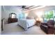 Main bedroom featuring a tray ceiling, ceiling fan, sitting area and lots of natural light at 121 Walter Hagen Dr, Mebane, NC 27302
