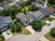 Aerial view of a house showing the surrounding neighborhood, driveway, and landscaping at 1218 Crystalwater Dr, Fuquay Varina, NC 27526