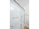 Accessible bathroom features a glass-door shower with grab bars and built-in seat at 1218 Crystalwater Dr, Fuquay Varina, NC 27526