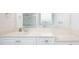 Bathroom featuring a vanity with white cabinets, granite countertop, sink, and mirror at 1218 Crystalwater Dr, Fuquay Varina, NC 27526