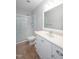 Bright bathroom features a glass-door shower and white vanity with ample storage at 1218 Crystalwater Dr, Fuquay Varina, NC 27526
