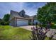Charming home boasts a brick facade, well-manicured lawn, and an attached two-car garage at 1218 Crystalwater Dr, Fuquay Varina, NC 27526