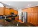 Kitchen with granite counters, stainless steel appliances, and wooden cabinets at 1218 Crystalwater Dr, Fuquay Varina, NC 27526