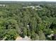 Aerial image of a property nestled among a lush forest canopy at 126 Barclay Rd, Chapel Hill, NC 27516