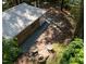 Aerial view of a backyard with a fire pit, chairs and landscaped surroundings at 126 Barclay Rd, Chapel Hill, NC 27516