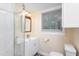 Bright bathroom with shower, gray floors, and white sink at 126 Barclay Rd, Chapel Hill, NC 27516