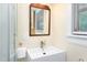 Bright bathroom features a modern sink, a square mirror, and a stylish faucet at 126 Barclay Rd, Chapel Hill, NC 27516