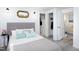Relaxing bedroom with a stylish bed, closet, and a glimpse into the bathroom at 126 Barclay Rd, Chapel Hill, NC 27516