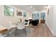 Dining area with a glass table and views through a window into another room at 126 Barclay Rd, Chapel Hill, NC 27516