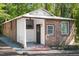 Charming brick home featuring a covered entry and gravel landscaping at 126 Barclay Rd, Chapel Hill, NC 27516
