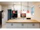 Bright kitchen featuring white cabinetry, butcher block countertops, pendant lighting, and stainless steel appliances at 126 Barclay Rd, Chapel Hill, NC 27516