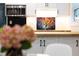 Modern kitchen showcases white cabinets, butcher block counters, colorful backsplash, and stainless steel appliances at 126 Barclay Rd, Chapel Hill, NC 27516