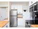 Well-equipped kitchen with stainless steel refrigerator, oven, and ample storage, offering modern convenience and functionality at 126 Barclay Rd, Chapel Hill, NC 27516