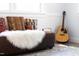 Living room showcasing colorful pillows, a cozy throw, and natural light at 126 Barclay Rd, Chapel Hill, NC 27516