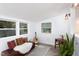 Comfortable living room with decorative pillows, a guitar, and natural light from the window at 126 Barclay Rd, Chapel Hill, NC 27516