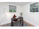 Office area with modern desk, neutral walls, patterned rug and bright windows at 126 Barclay Rd, Chapel Hill, NC 27516