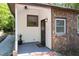 Inviting porch with white wood, brick accents, dark trim, and a stylish entrance for a cozy and welcoming feel at 126 Barclay Rd, Chapel Hill, NC 27516
