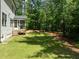 Spacious backyard with a screened-in porch at 1338 The Parks Dr, Pittsboro, NC 27312
