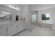 Bright bathroom with a double sink vanity, standalone tub, and glass enclosed shower at 1338 The Parks Dr, Pittsboro, NC 27312