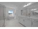 Bright bathroom with a double vanity, standalone tub, glass shower, and modern finishes at 1338 The Parks Dr, Pittsboro, NC 27312