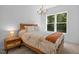 Comfortable bedroom featuring a large window for natural light at 1338 The Parks Dr, Pittsboro, NC 27312