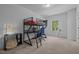 Bedroom with a modern loft bed, a desk, and a telescope near the window at 1338 The Parks Dr, Pittsboro, NC 27312