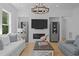 Comfortable living room features custom built-ins, fireplace, and stylish decor at 1338 The Parks Dr, Pittsboro, NC 27312
