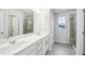 Bathroom featuring double sinks, a walk-in shower, and modern fixtures at 1412 Maple Branch Cir # 35, Graham, NC 27253