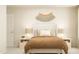 Nicely staged bedroom with a bed, neutral tones, and decorative wall art at 1412 Maple Branch Cir # 35, Graham, NC 27253