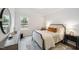 Bedroom featuring a comfortable bed, stylish furnishings, and a large window at 1412 Maple Branch Cir # 35, Graham, NC 27253