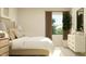 Bright bedroom featuring a bed, nightstands, a window with curtains, and decorative accents at 1412 Maple Branch Cir # 35, Graham, NC 27253