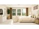 Bedroom with a cozy sitting area, large window, and neutral decor at 1412 Maple Branch Cir # 35, Graham, NC 27253