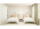 Charming twin bedroom with matching beds, neutral tones, and cute bunny wall art at 1412 Maple Branch Cir # 35, Graham, NC 27253
